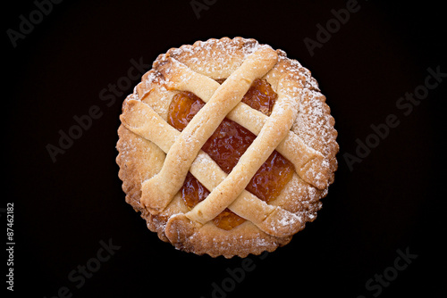 Short pastry tartlet with marmalade. photo