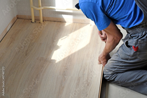 laying laminate in bathroom