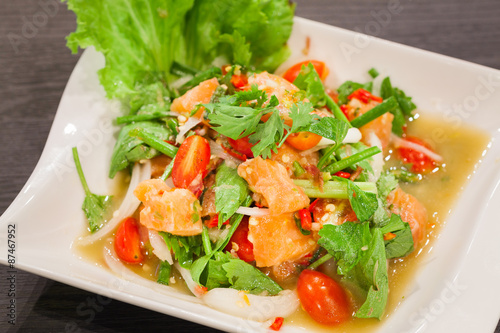 Spicy salmon salad with mixed vegetable and herb