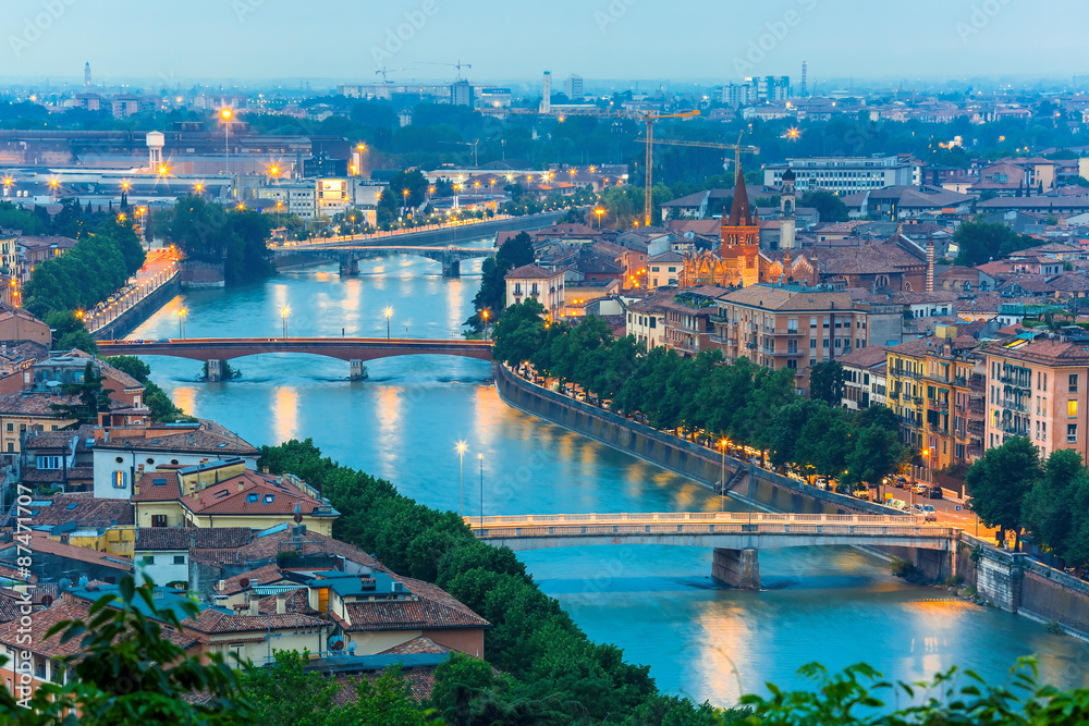 Naklejka premium River Adige and bridges in Verona at night, Italy