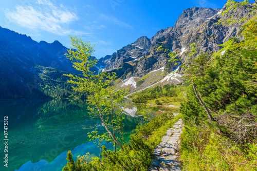 Fototapeta Naklejka Na Ścianę i Meble -  Path along beautiful green water Morskie Oko lake, Tatra Mountains, Poland