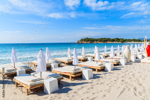 Sunchairs on famous white sand Palombaggia beach, Corsica island, France © pkazmierczak