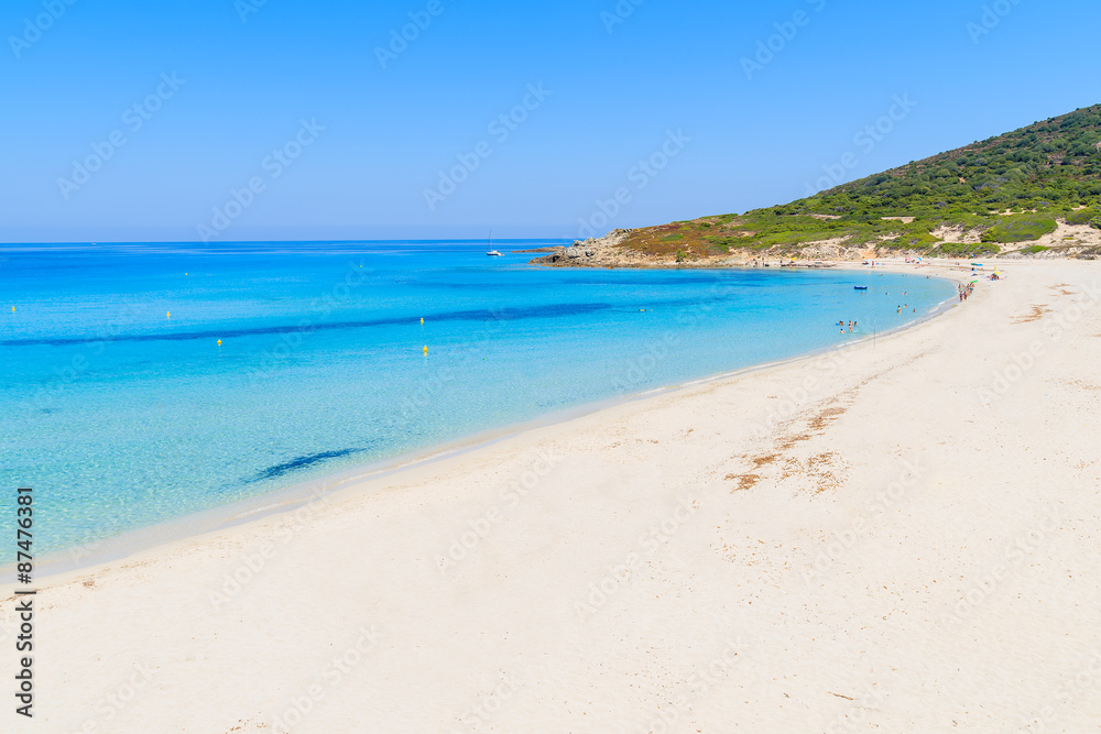 Stunning sandy Bodri beach near L'lle Rousse with azure sea water, Corsica island, France