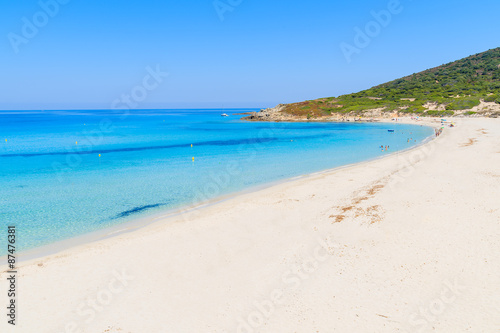 Stunning sandy Bodri beach near L'lle Rousse with azure sea water, Corsica island, France © pkazmierczak