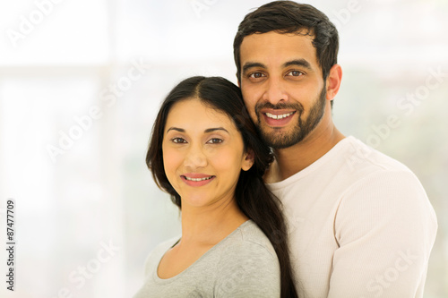 young indian couple looking at the camera