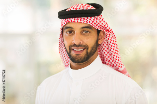 middle eastern man looking at the camera
