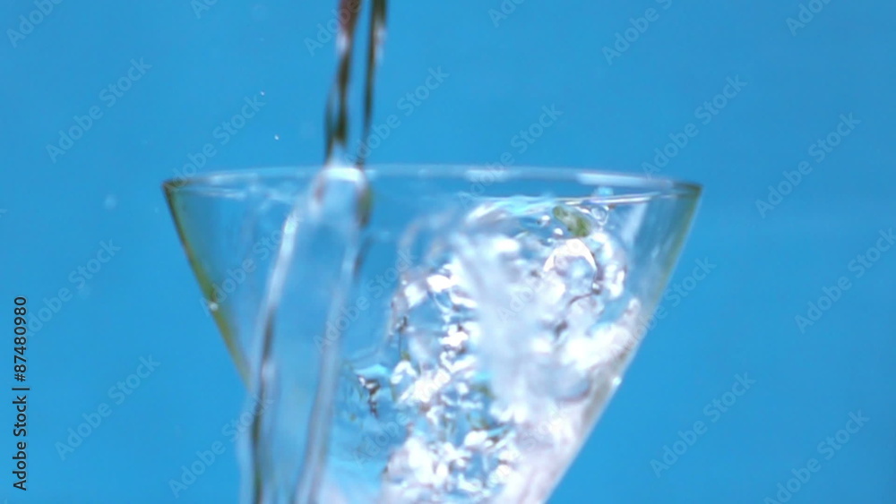 Water splash in martini glass shooting with high speed camera.Pouring cocktail into martini glass shooting with high speed camera. 500 fps Water splash in martini glass shooting with high speed camera.Pouring cocktail into martini glass shooting with high speed camera. 500 fps