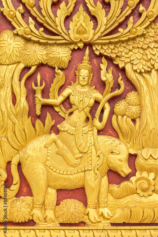 Wood carvings, gold On a red background in temple ,Thailand