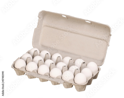 Cardboard egg box with white chicken eggs isolated on white back