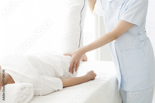 Women undergoing massage legs