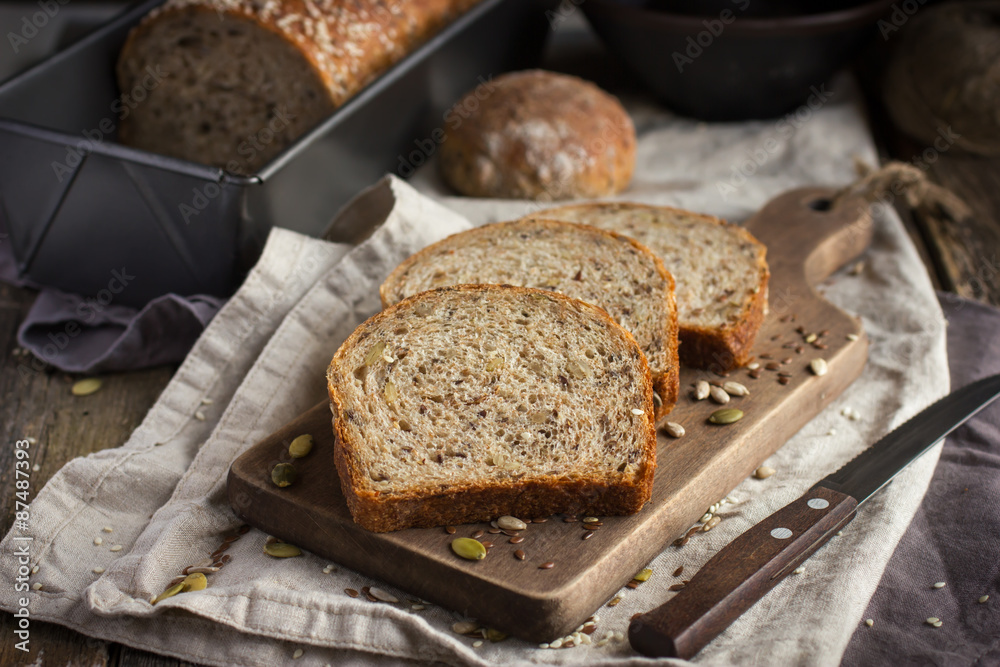 fresh multigrain bread on rustic background fresh multigrain bread on rustic background