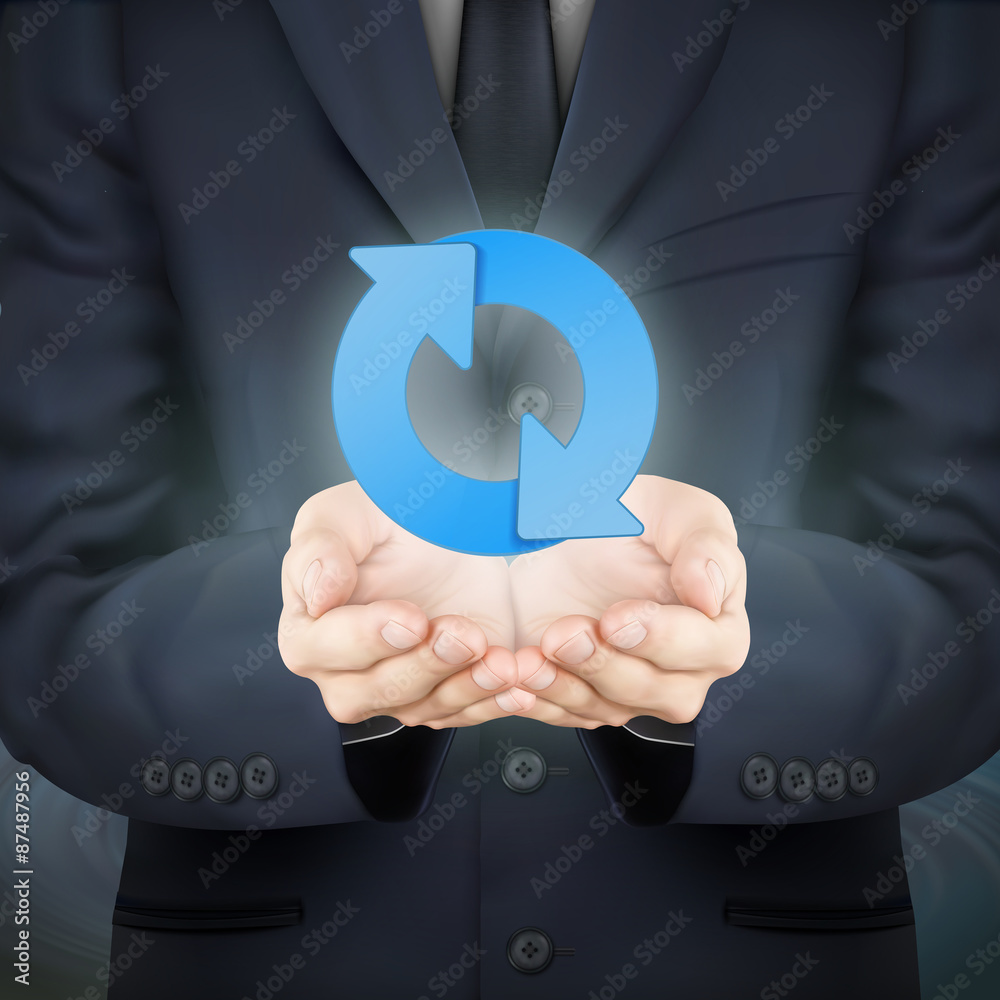 businessman holding arrow sign businessman holding arrow sign