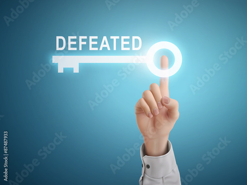 male hand pressing defeated key button