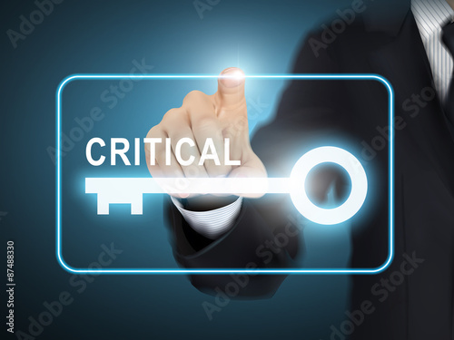 male hand pressing critical key button