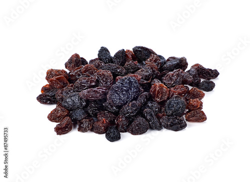Pile of raisins on white background.