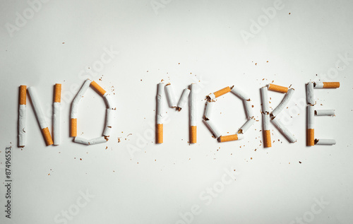Cigarette arranged as a word no more