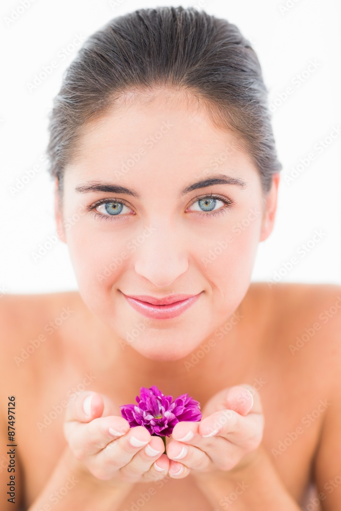 A portrait smiling pretty brunette with flower A portrait smiling pretty brunette with flower
