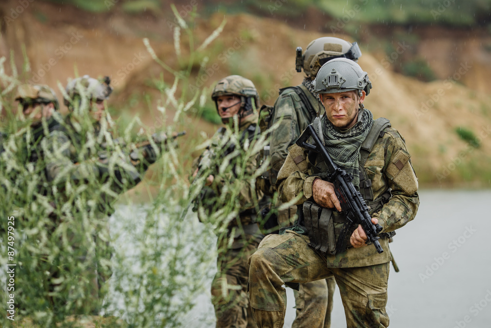 Portrait of a ranger in the battlefield with a gun Portrait of a ranger in the battlefield with a gun