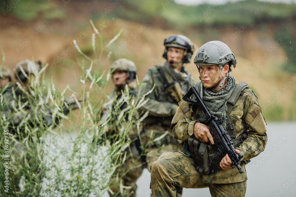 Portrait of a ranger in the battlefield with a gun