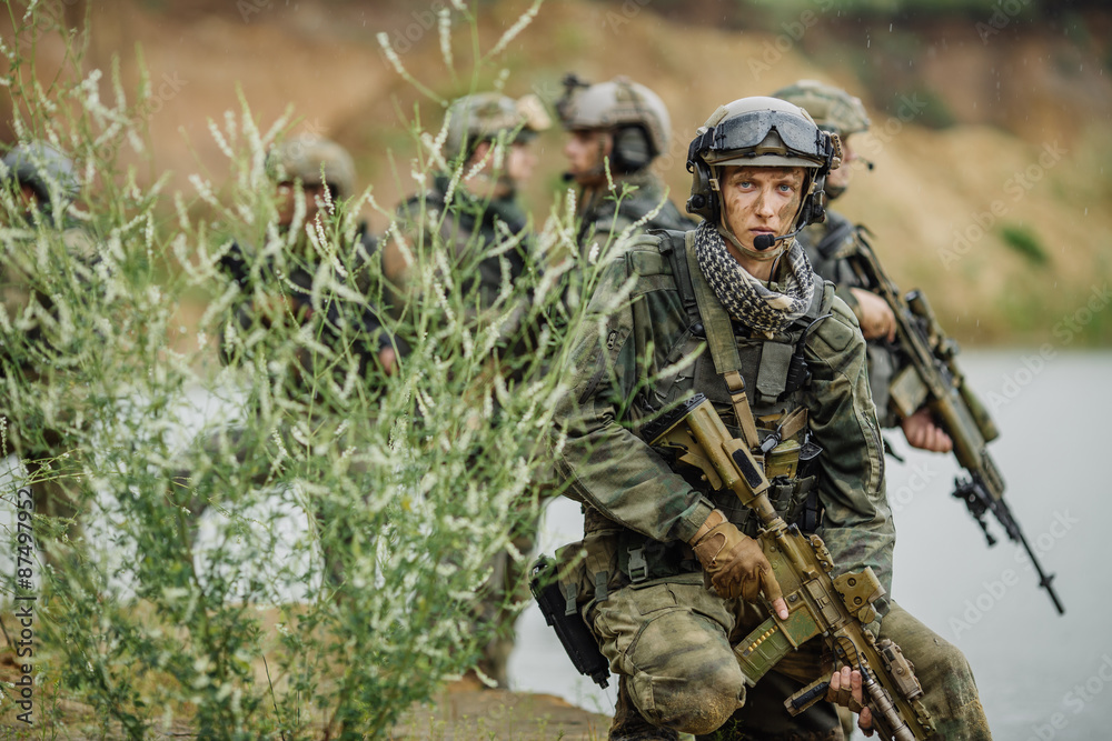 Portrait of a ranger in the battlefield with a gun