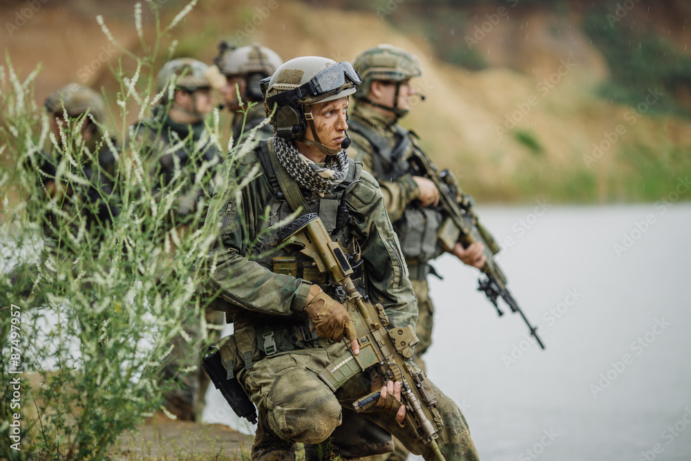 Portrait of a ranger in the battlefield with a gun