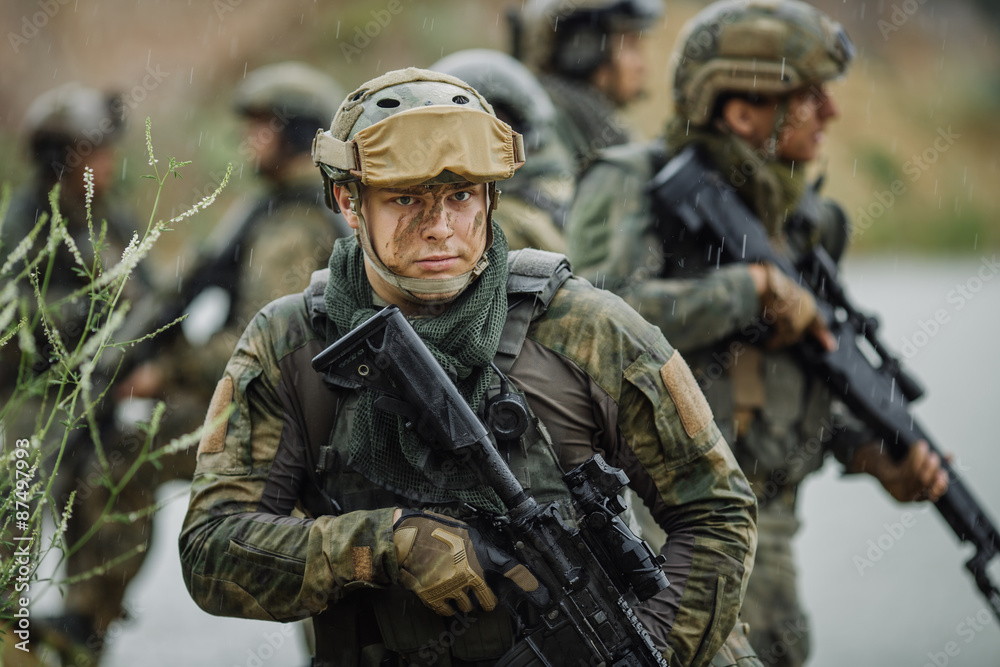 Portrait of a ranger in the battlefield with a gun