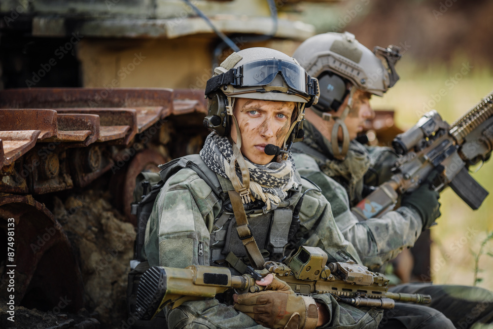 Portrait of a ranger in the battlefield with a gun Portrait of a ranger in the battlefield with a gun