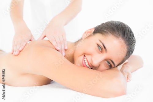 Pretty brunette enjoying a massage