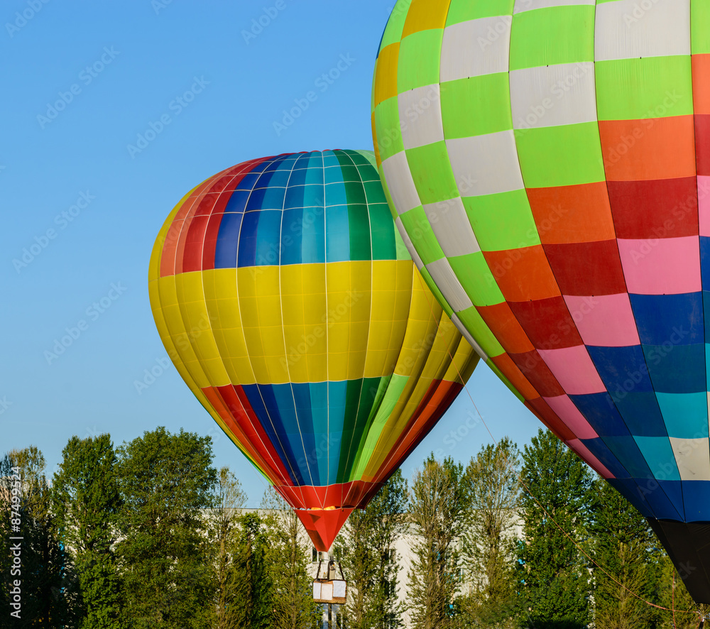 Obraz premium Colorful Hot Air Balloons prepare for flight