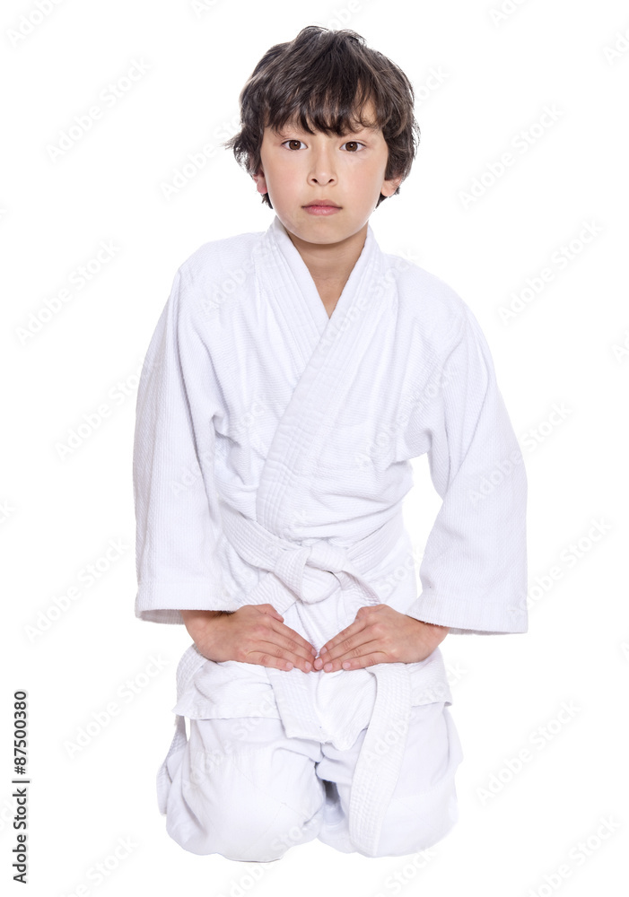 young asian boy isolated on white in judo clothing doing martial arts young asian boy isolated on white in judo clothing doing martial arts