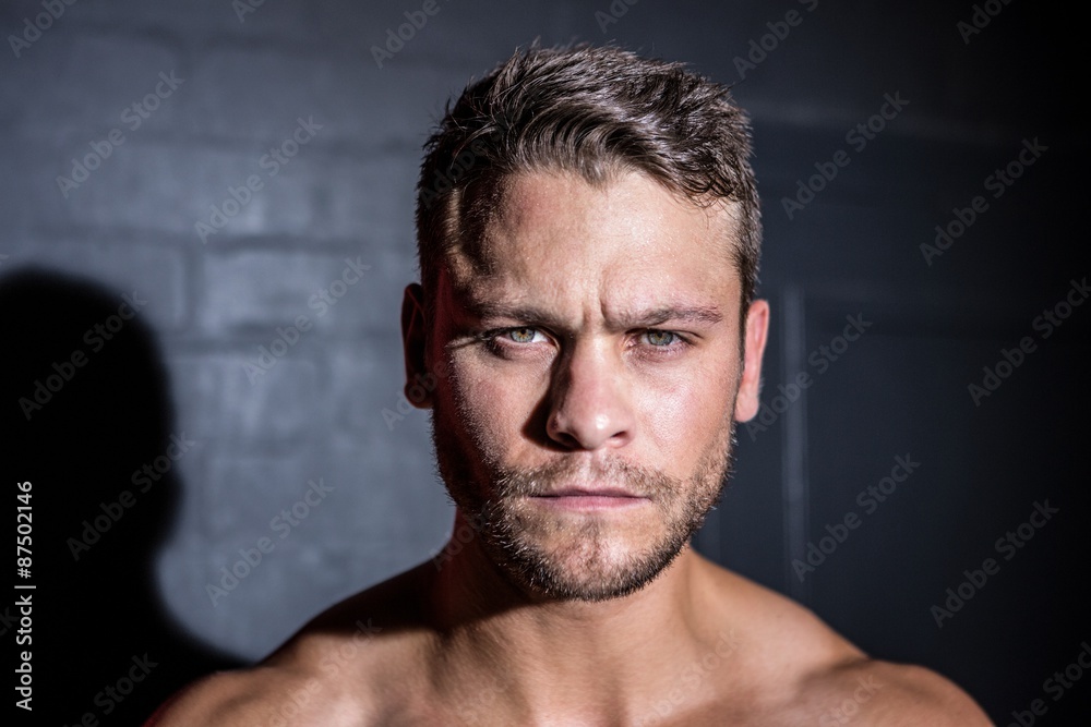 Portrait of serious muscular man looking at camera Portrait of serious muscular man looking at camera