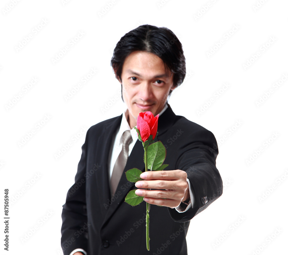 Businessman holding a rose,attractive 40 years old asion man on Businessman holding a rose,attractive 40 years old asion man on