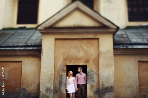 cute romantic gentle beautiful redhead stylish girl and her boyfriend spend good time in lviv © syrotkin