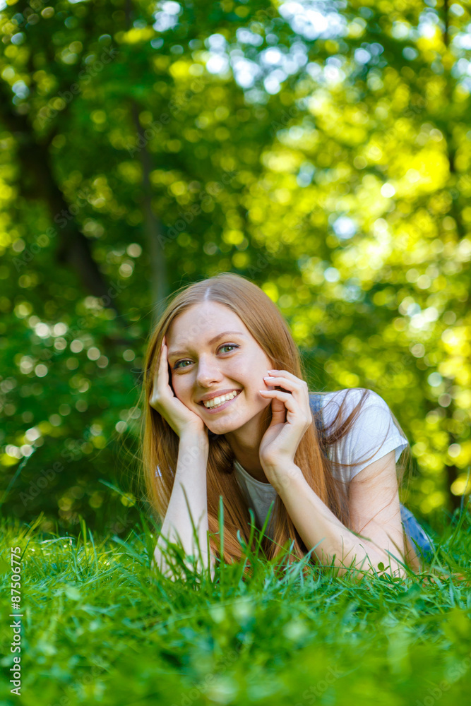 Beautiful smiling red-haired young woman Beautiful smiling red-haired young woman