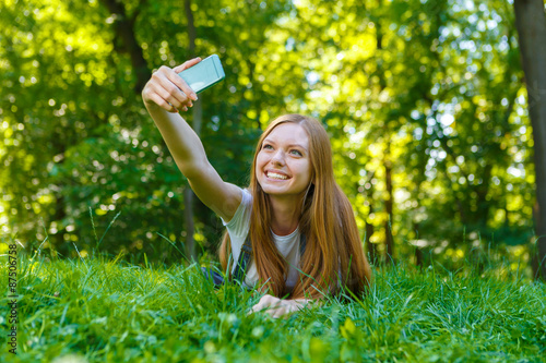 Beautiful smiling red-haired young woman