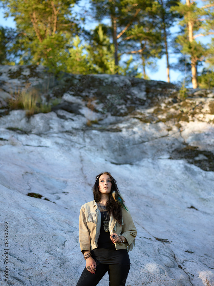 Naklejka premium Attractive young woman and feather headpiece