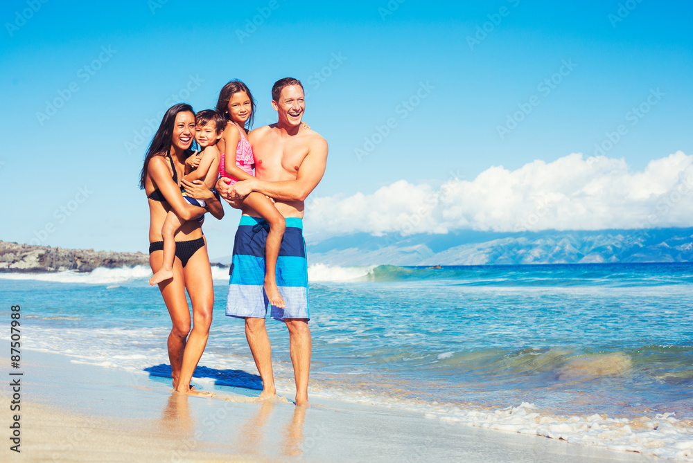 Happy Family Having Fun at the Beach