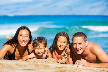Happy Family Having Fun at the Beach