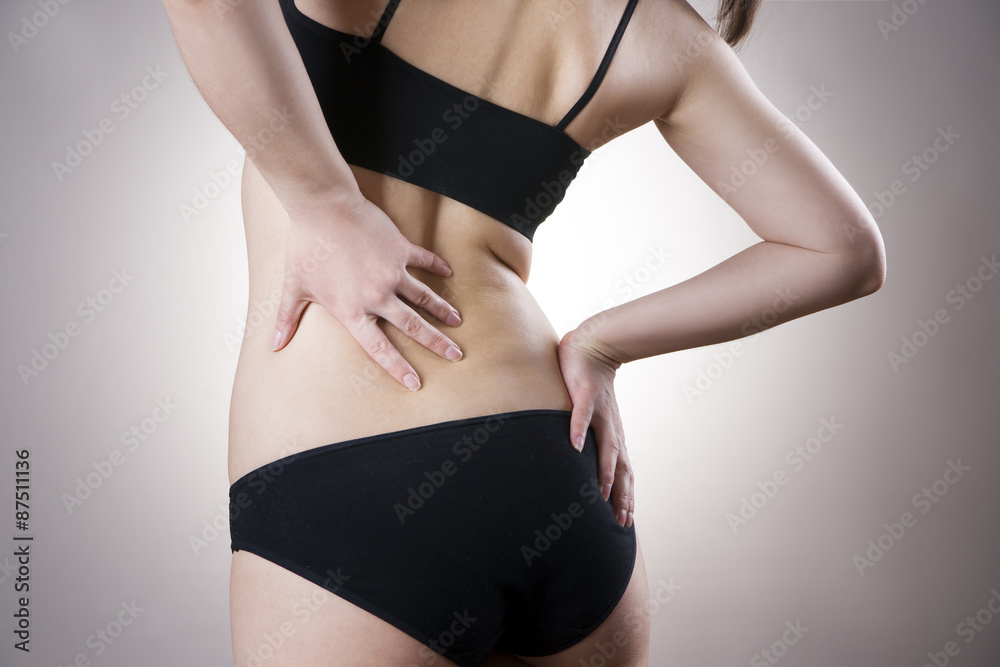 Fototapeta premium Woman with backache. Pain in the human body
