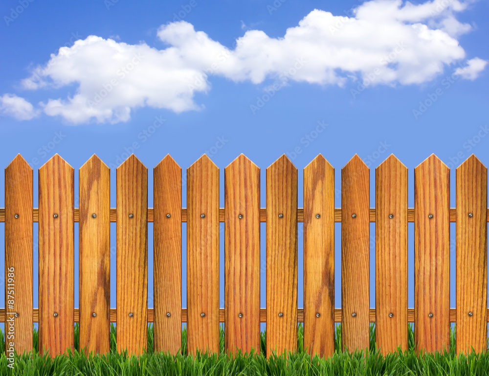 Wood fence and blue sky horizon with clouds in summer day Wood fence and blue sky horizon with clouds in summer day