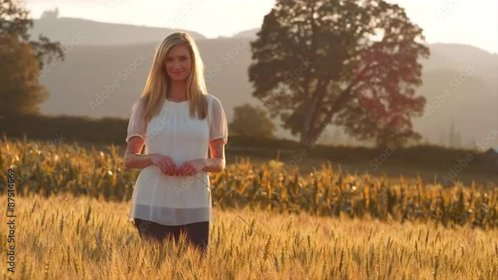 Beautiful Blonde Woman Standing in a Wheat Field Beautiful Blonde Woman Standing in a Wheat Field
