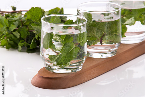 Infused fresh fruit water of mint leaf. isolated over white