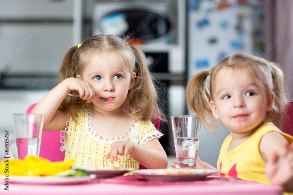 Children drinking and eating at daycare Children drinking and eating at daycare