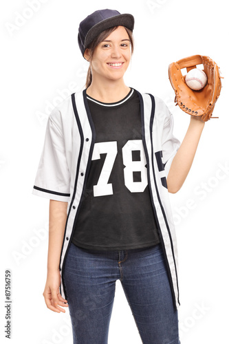 Young woman in a jersey holding a baseball