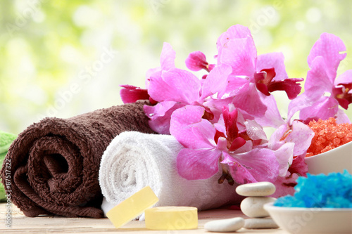 Spa still life with essential oil  salt  orchid and towel