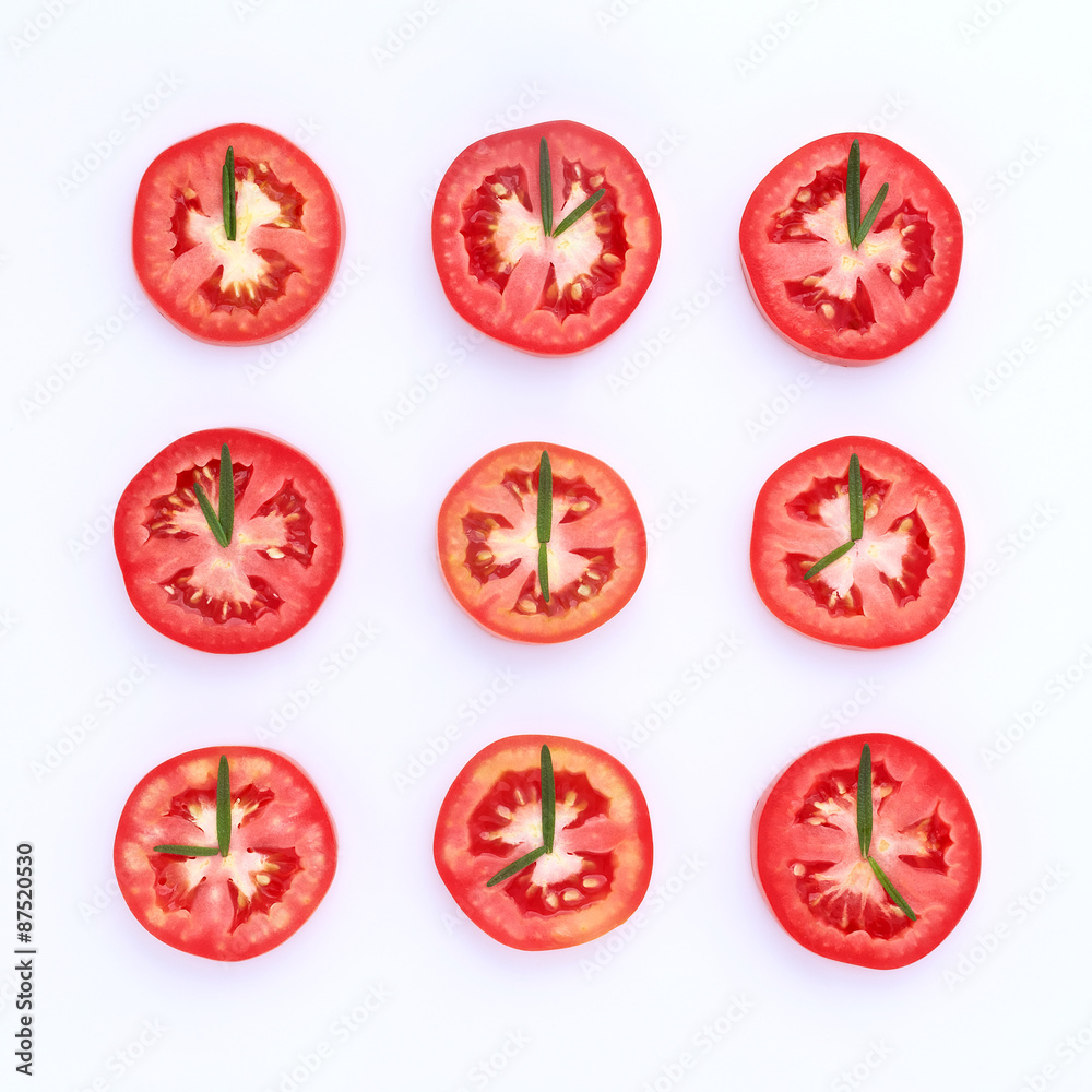 fresh tomato cut half with rosemary leaf as a clock. World clock fresh tomato cut half with rosemary leaf as a clock. World clock