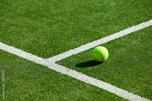 tennis ball on tennis grass court © kireewongfoto