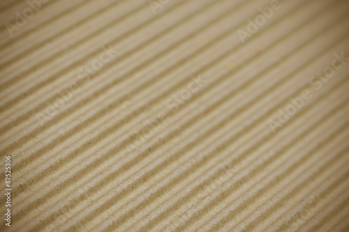 Brown corrugated cardboard background selective focus