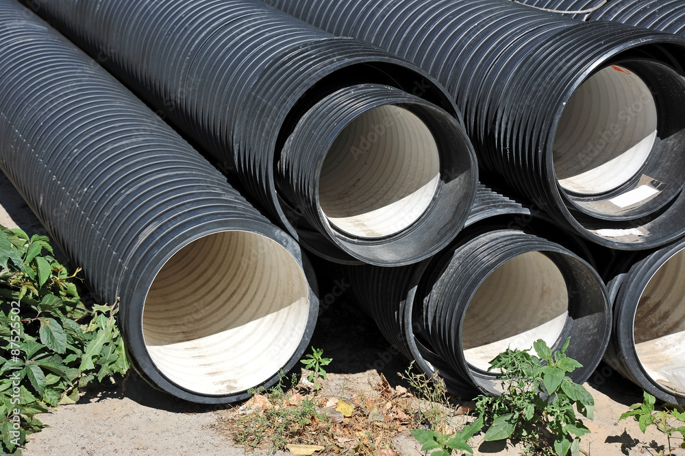 Stacked new PVC pipe on construction site Stock Photo Adobe Stock