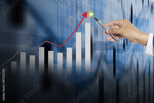 Businessman and graphics growing graph